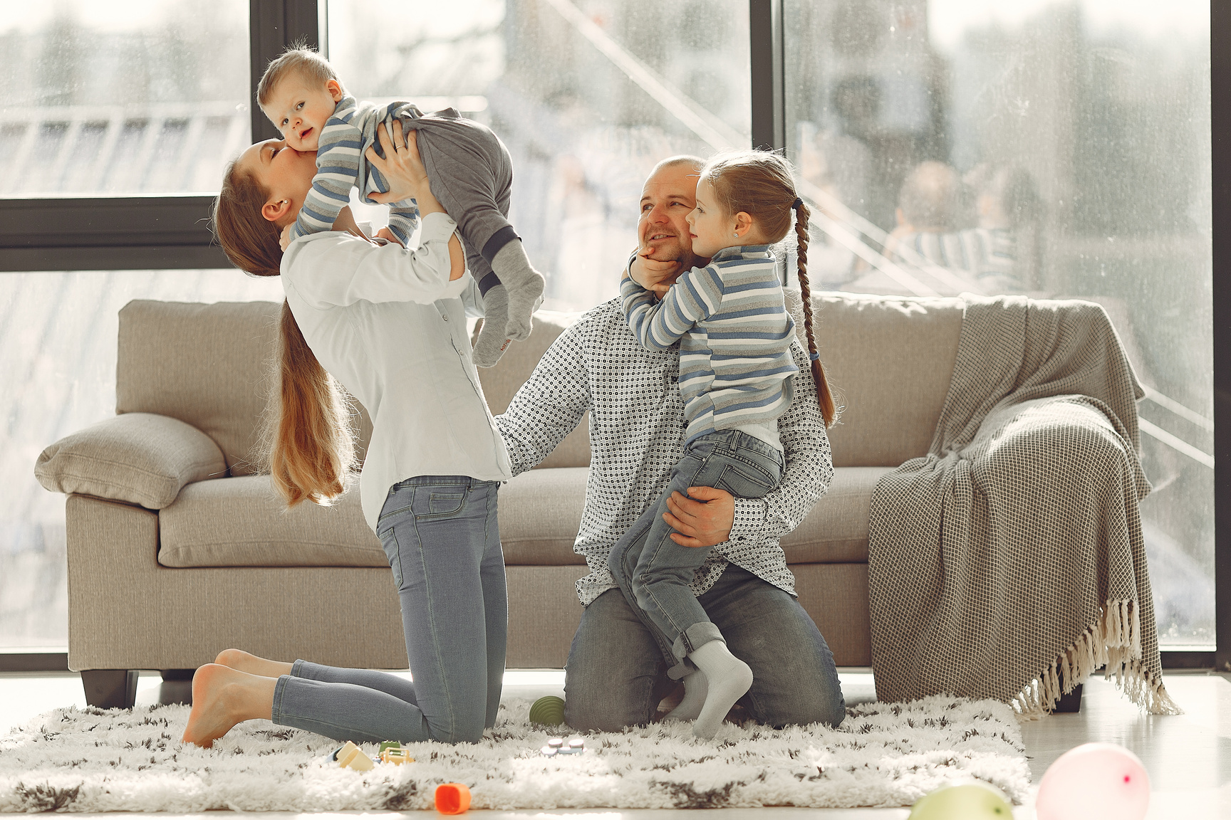 Happy family embracing while spending time at home